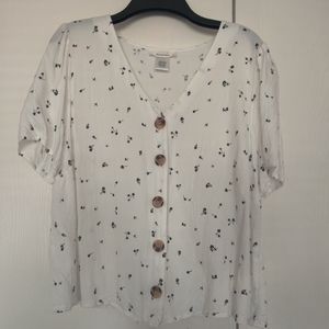 White blouse with flower details